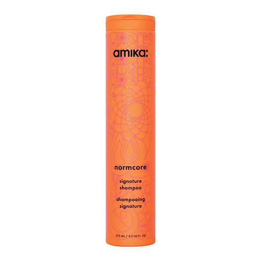 Amika Normcore signature shampoo bottle on a white background - Hair Care Canada