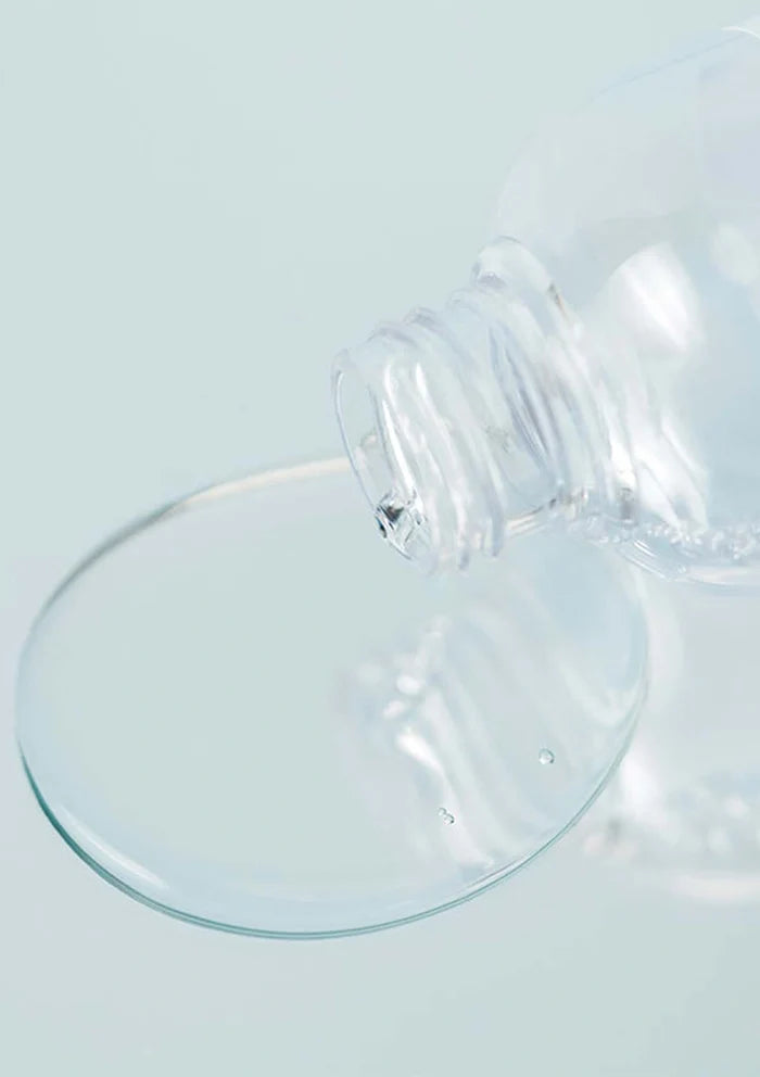Clear glass suction cup on a light blue background