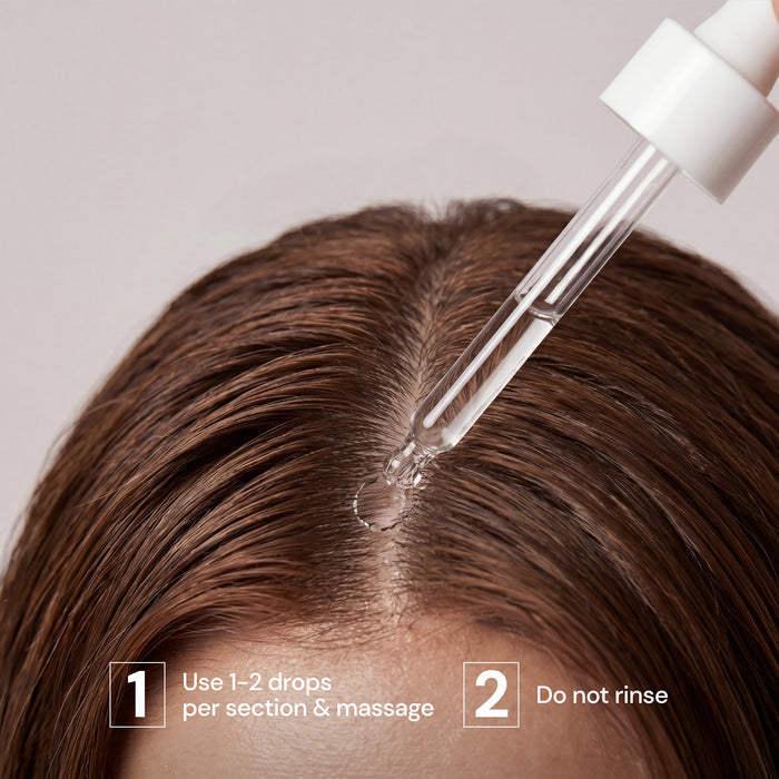 Dropper applying Scalp Calm Serum to scalp part with usage steps "Use 1-2 drops per section & massage" and "Do not rinse."