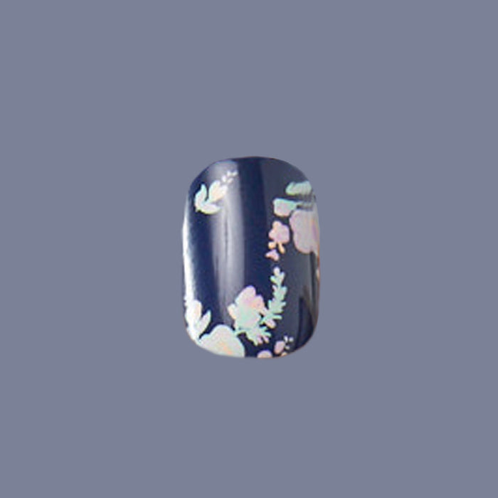 Single Micro Floral - Press-Ons | Extra Short | Squoval nail featuring delicate pastel flowers on dark navy base