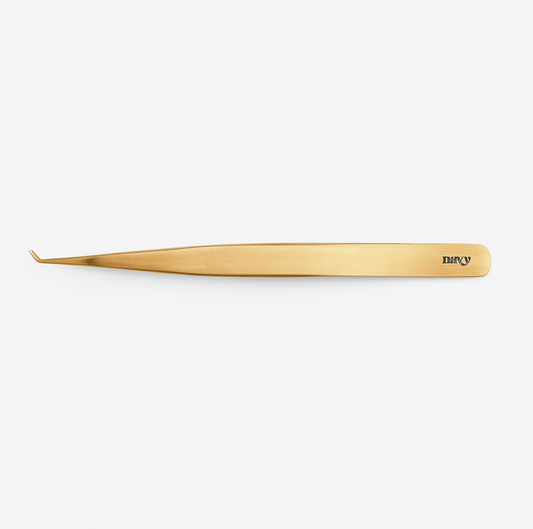 A pair of extended detail tweezers with a titanium coating, primarily gold in color, branded with the name 'Sandra'.